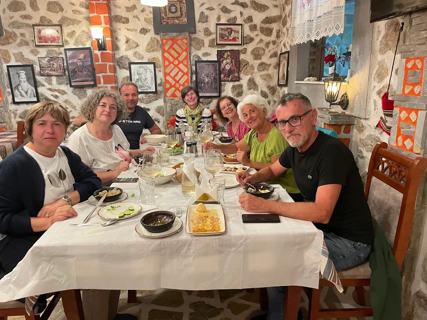 Guests gathered around a shared dining table at Tradita Shqiptare.